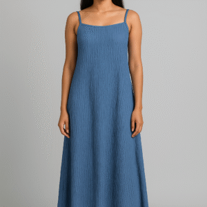 Woman wearing a textured blue spaghetti strap maxi dress