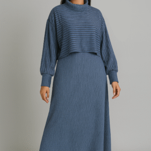 Woman wearing a textured blue maxi dress layered with a matching cropped striped top