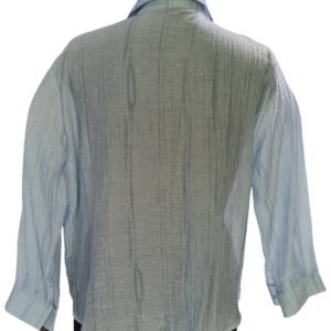 Close-up of bead embellishments on blue textured shirt
