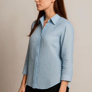 Model wearing Azure Grace Beaded Shirt with navy trousers