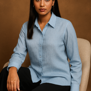 Model wearing Azure Grace Beaded Shirt with navy trousers