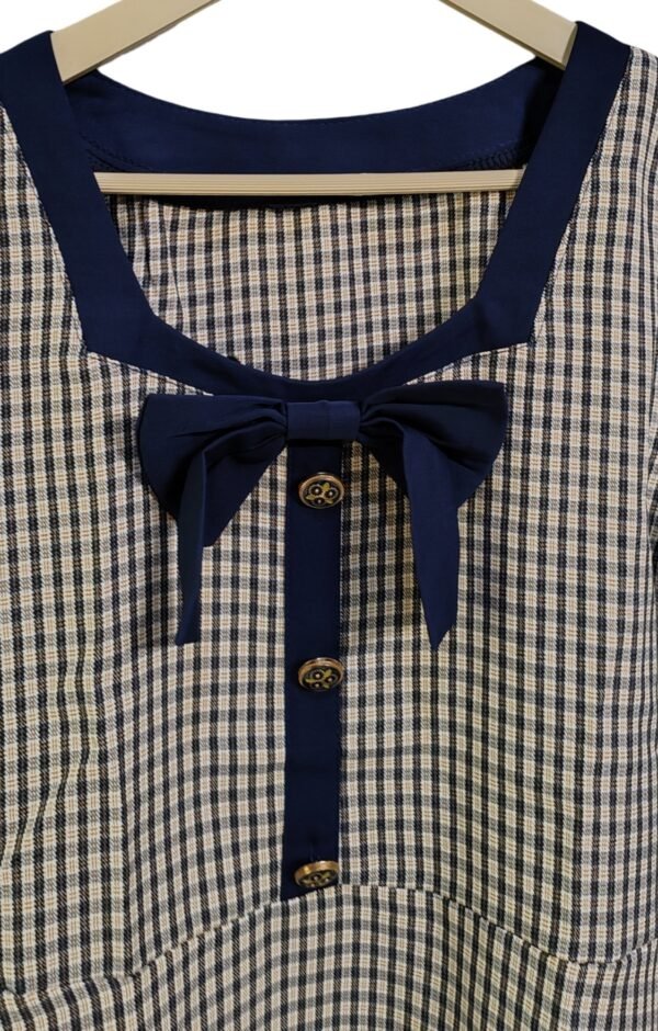 Flared beige and navy check dress with short sleeves and front button detail