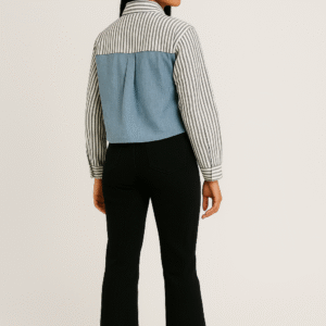 Woman in striped and denim-paneled shirt