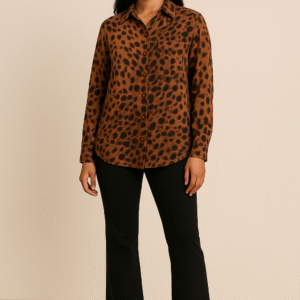 Model wearing elegant amber-brown animal print shirt with full sleeves and black tailored trousers