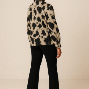 Woman wearing abstract marble print shirt with black jeans