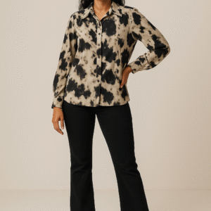 Woman wearing abstract marble print shirt with black jeans