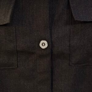 Striped and solid black combo shirt styled with black pants and sneakers for bold casual look