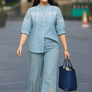 Woman wearing powder blue embroidered cotton denim shirt with mandarin collar