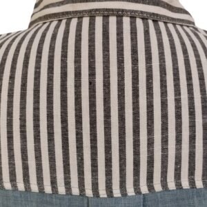 Woman in striped and denim-paneled shirt
