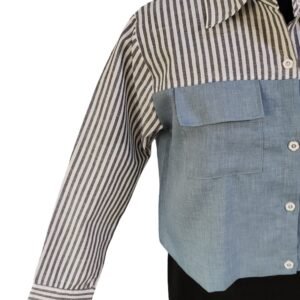 Woman in striped and denim-paneled shirt
