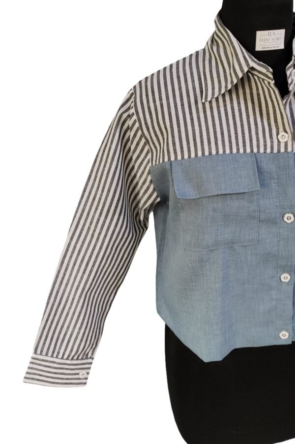 Woman in striped and denim-paneled shirt