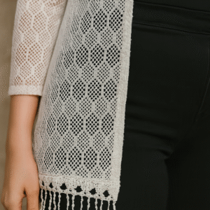 model wearing white crochet shrug with black outfit