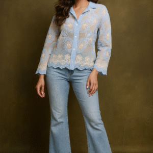 woman wearing sky-blue sheer embroidered shirt with scalloped hem