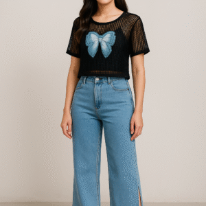 Model wearing black net top with spaghetti inner paired with blue jeans