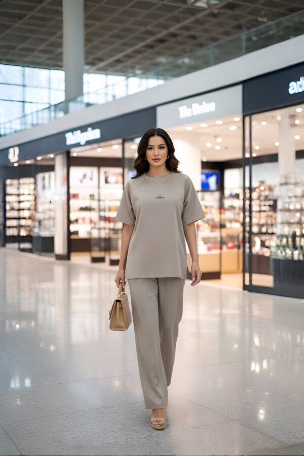 Elegant beige airport co-ord set with oversized top and trousers for women