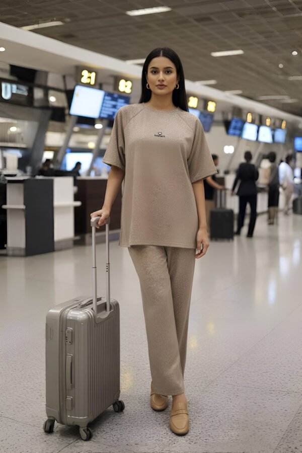 Elegant beige airport co-ord set with oversized top and trousers for women