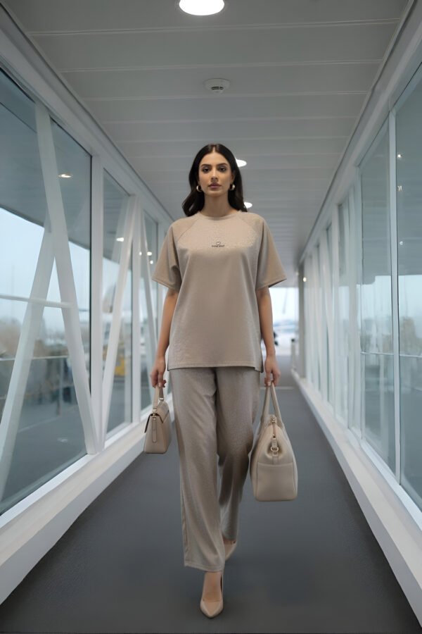 Elegant beige airport co-ord set with oversized top and trousers for women