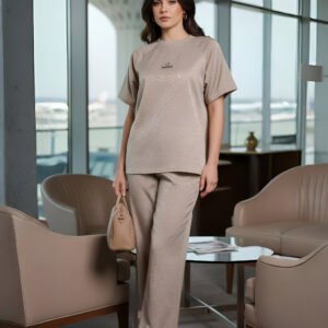 Elegant beige airport co-ord set with oversized top and trousers for women