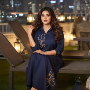 Two-piece navy co-ord outfit featuring shirt and A-line skirt with blooms