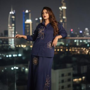 Two-piece navy co-ord outfit featuring shirt and A-line skirt with blooms