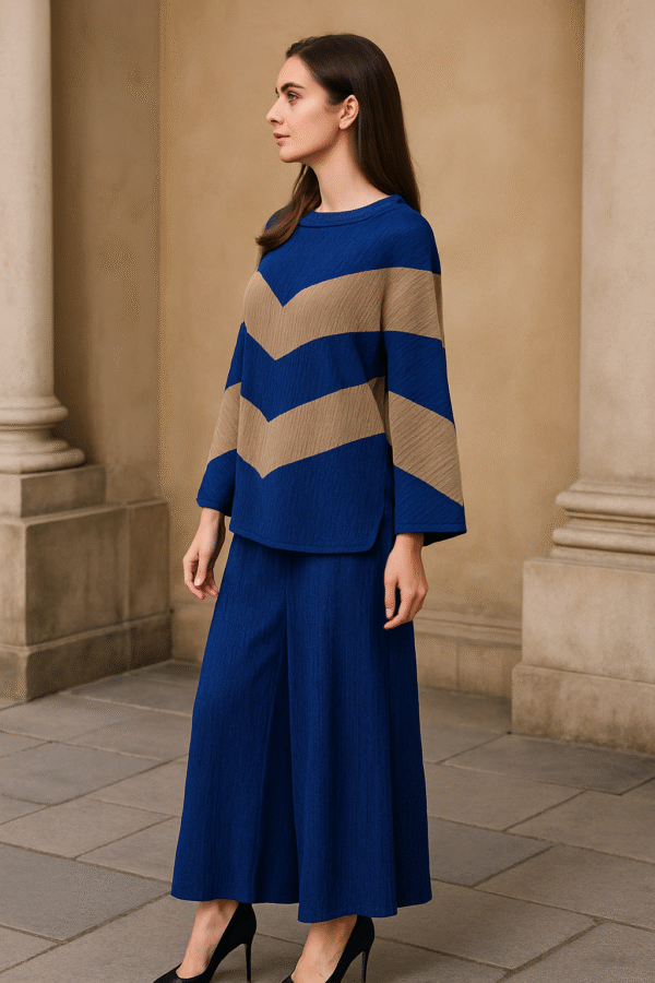 Woman wearing a blue and taupe chevron co-ord set with wide-leg pants