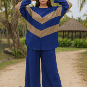 Woman wearing a blue and taupe chevron co-ord set with wide-leg pants