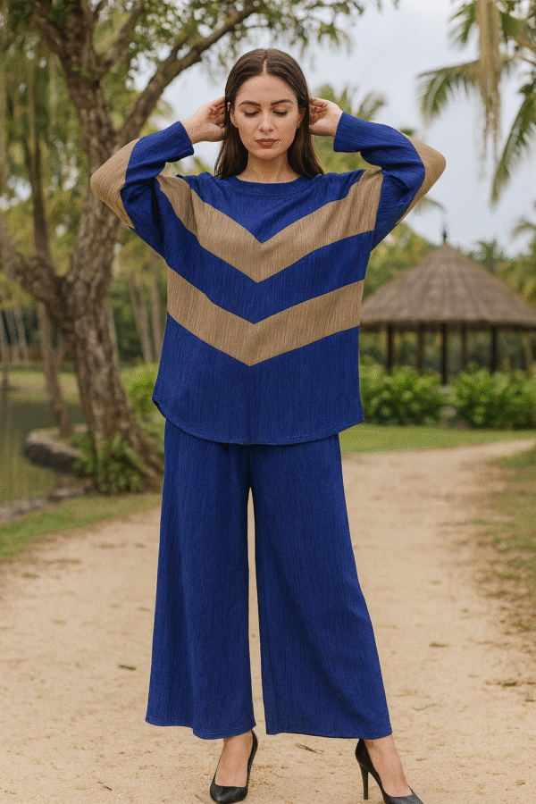 Woman wearing a blue and taupe chevron co-ord set with wide-leg pants